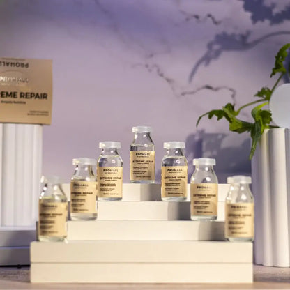Promall skincare product bottles on a display stand with a blurred background