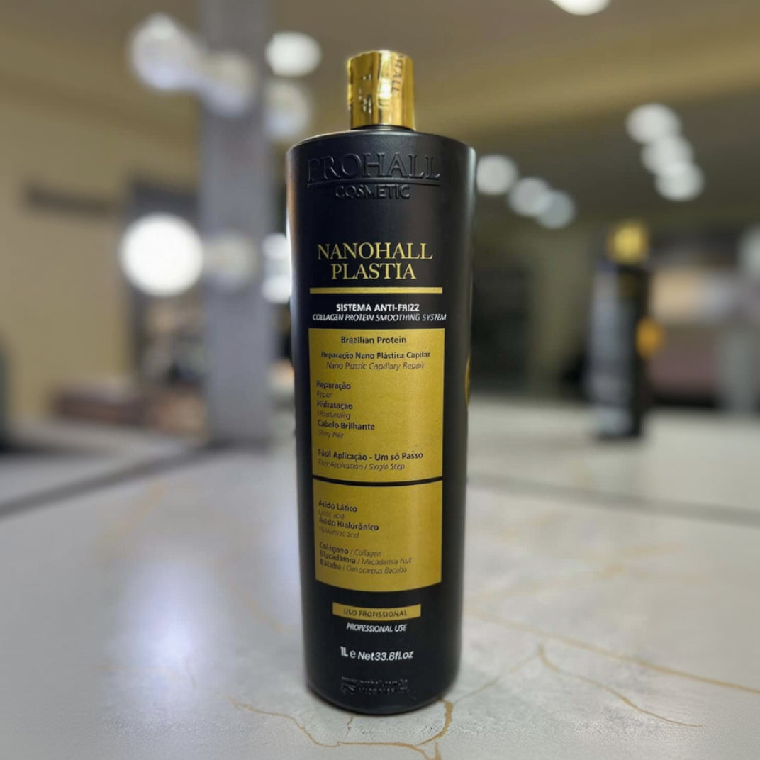 Nanohall Plastia hair product bottle on a marble surface with blurred background