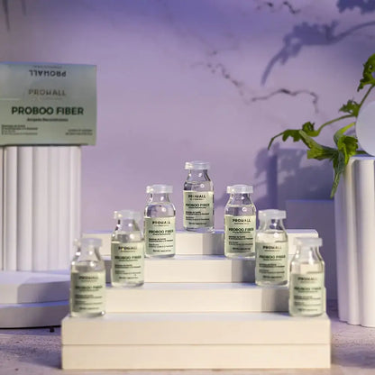 Probooo fiber bottles on a decorative stand with a purple background