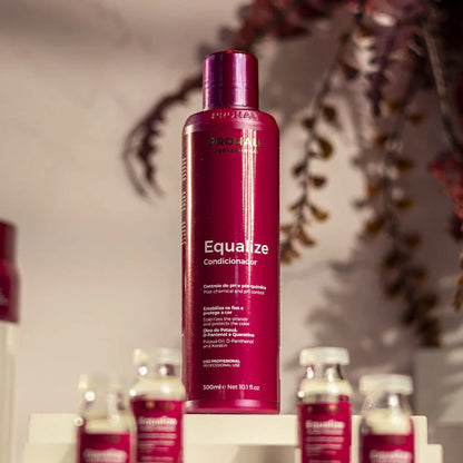 Red bottle labeled 'Equalize' on a white surface with blurred background