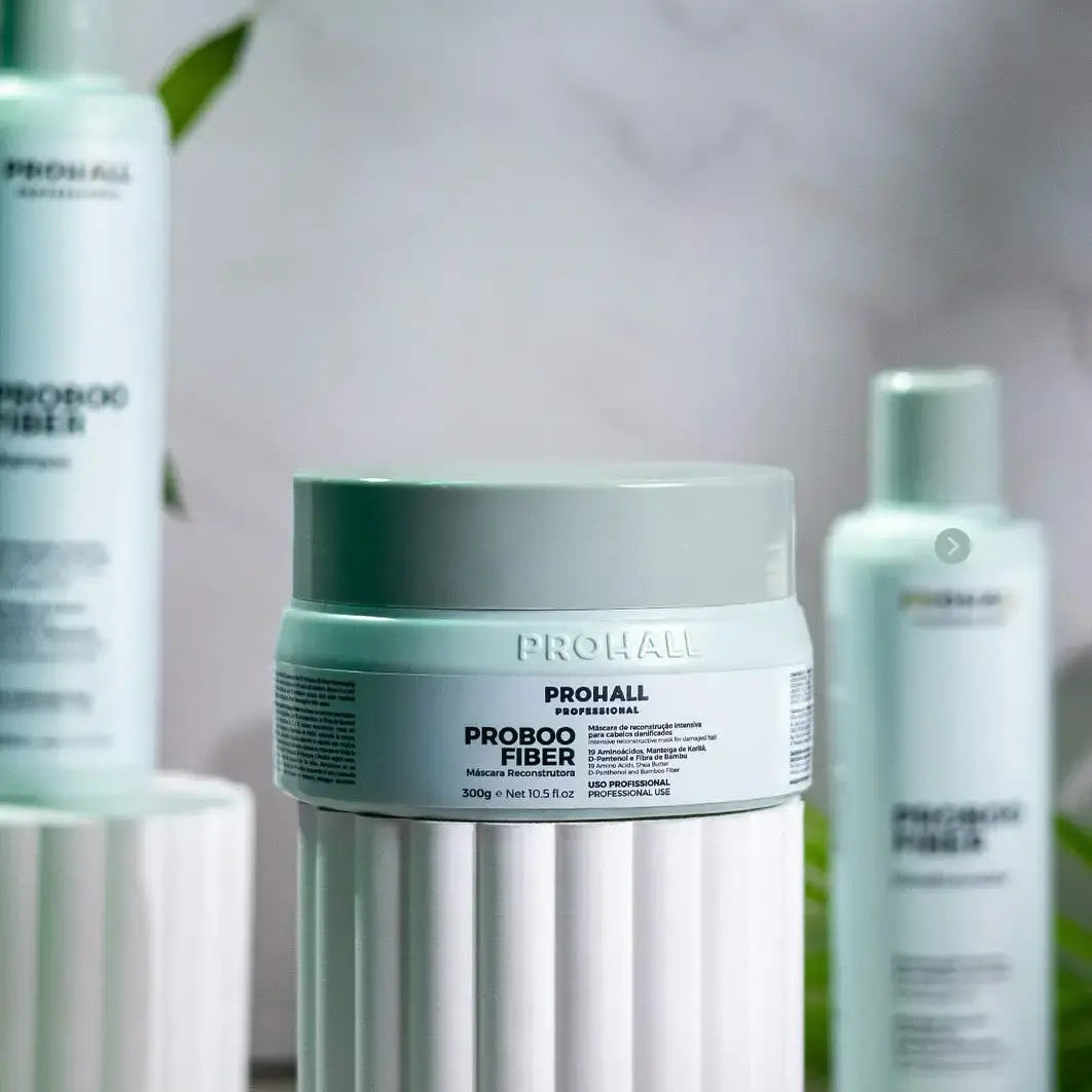 Prohall Proboo Fiber hair care products on a blurred background