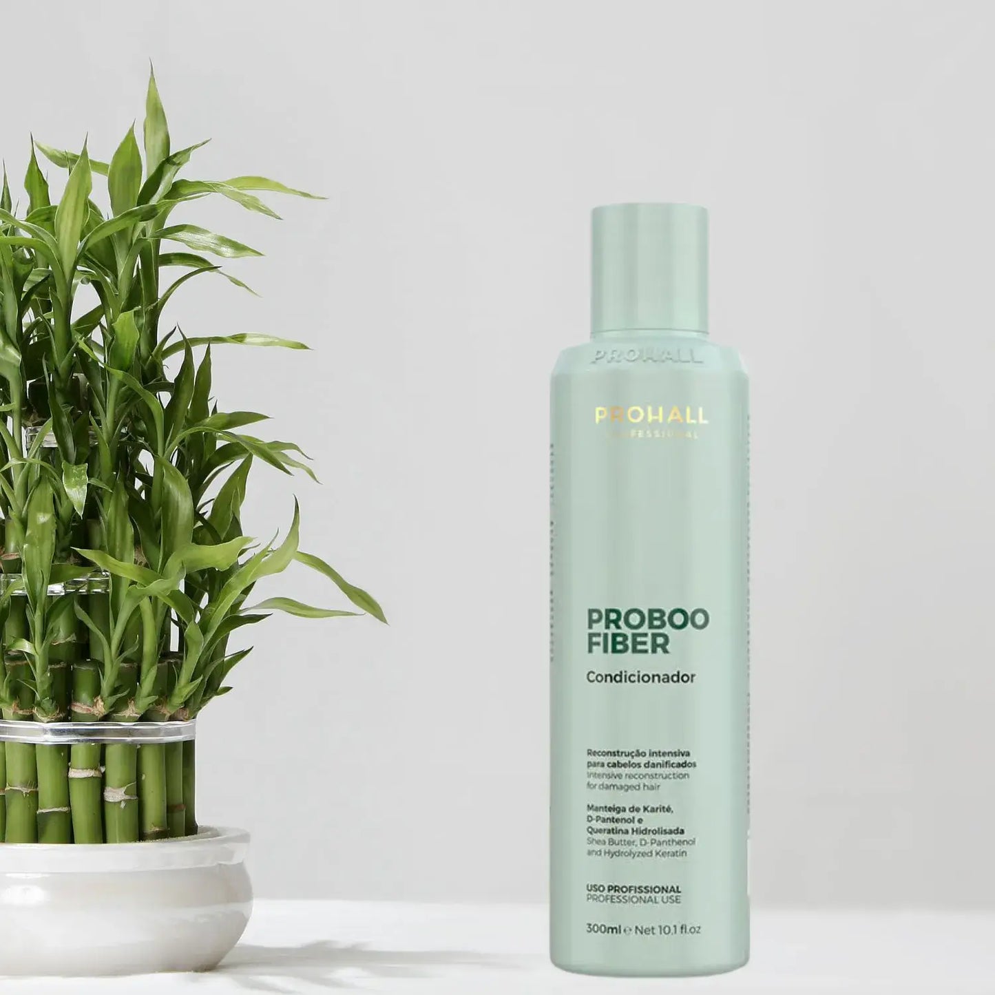 Probooo fiber conditioner bottle with a plant on a light background