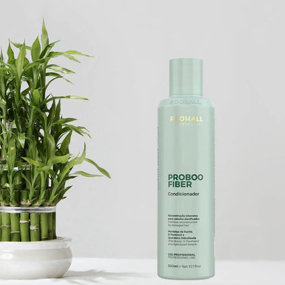 Probooo fiber conditioner bottle with a plant on a light background