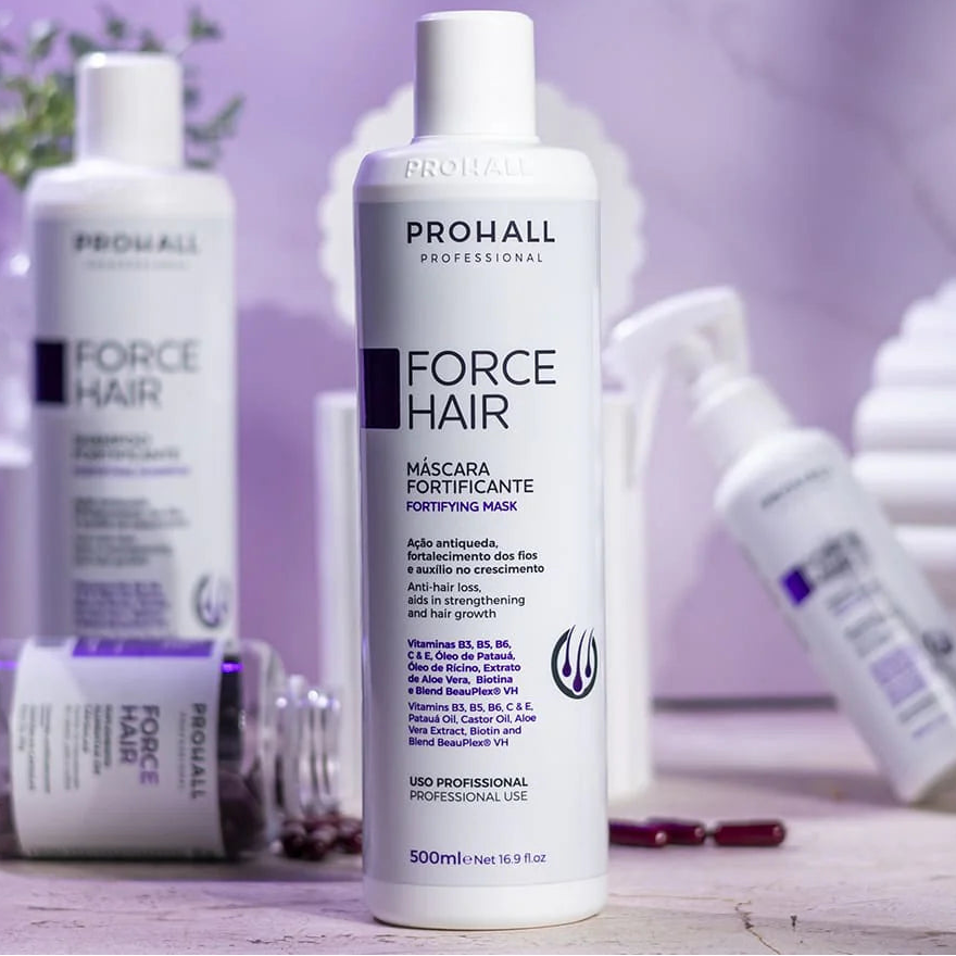 Prohall Force Hair mask bottle on a wooden surface with a blurred background