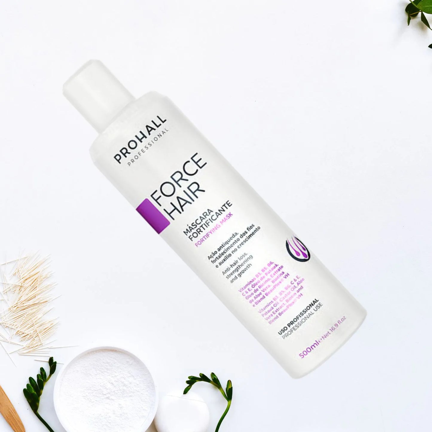 Prohall Force Hair product bottle on a white background with green leaves and a wooden stick.