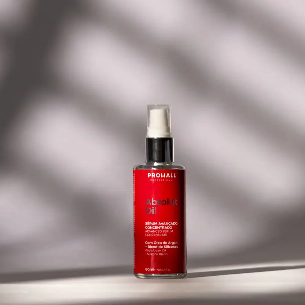 Red bottle with white spray nozzle on a gray background