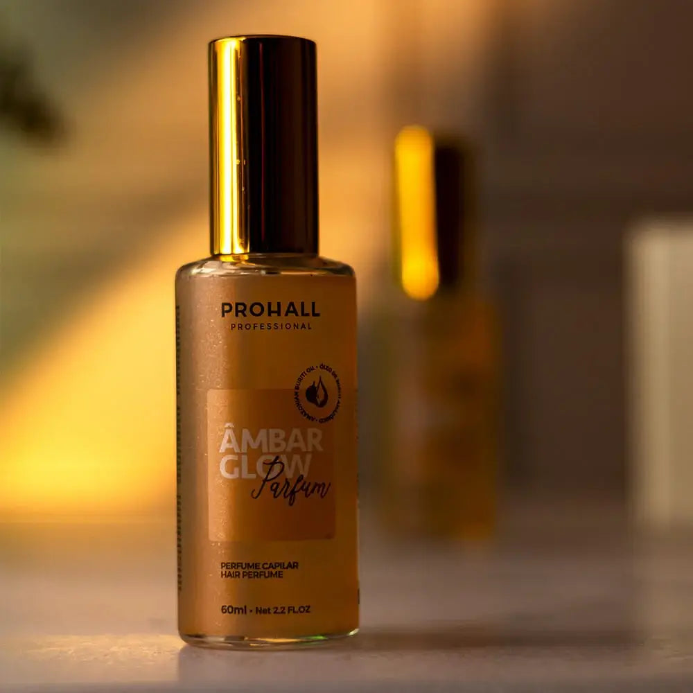 Amber glow perfume bottle with 'Prohall' branding on a blurred background