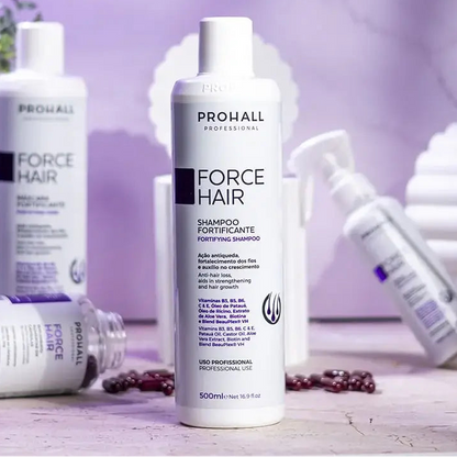 Prohall Force Hair shampoo bottle on a blurred background with other skincare products.