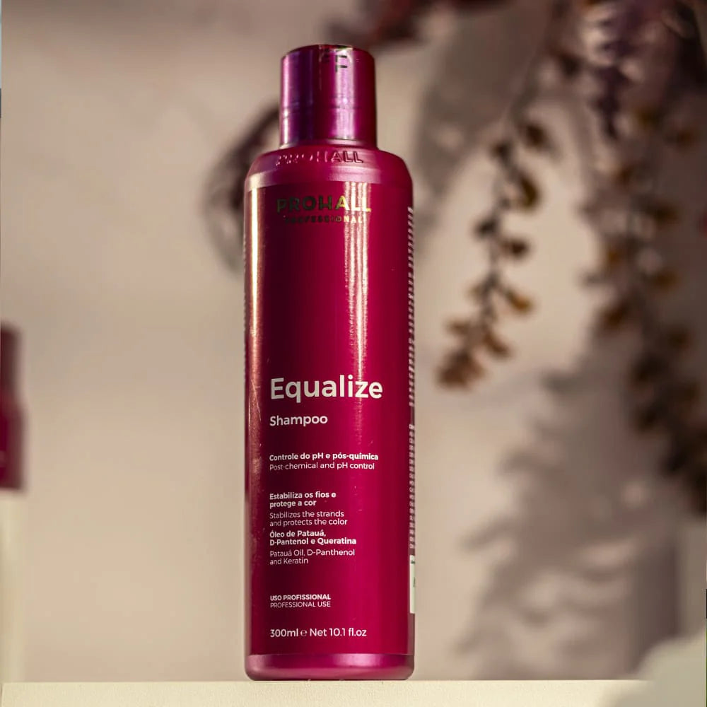 Shampoo Equalize bottle in a warm decorated background with brown leaves behind