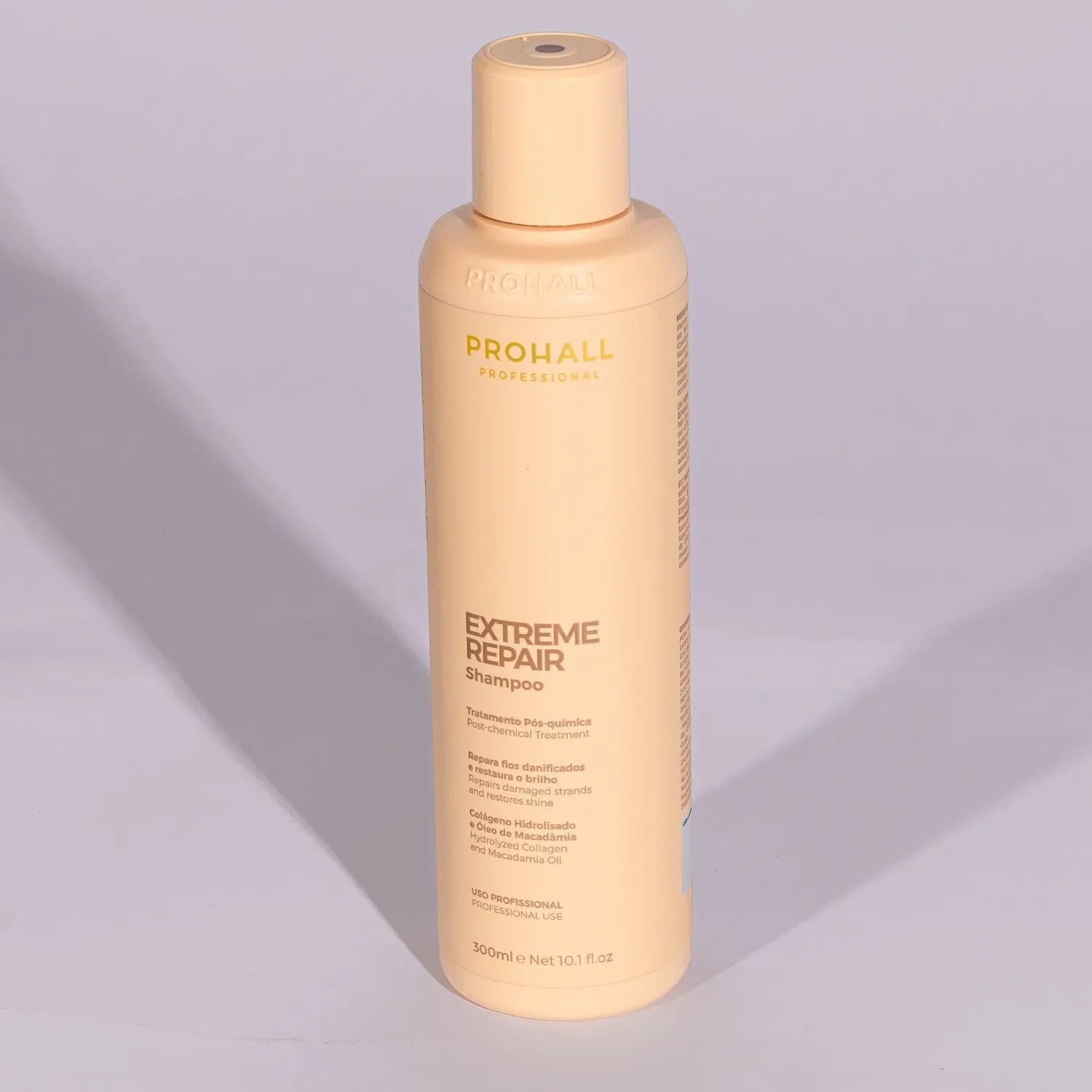 Prohall Extreme Repair shampoo bottle on a gradient background