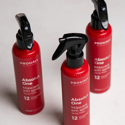Three red spray bottles with black nozzles labeled 'Prohall' on a light gray background.